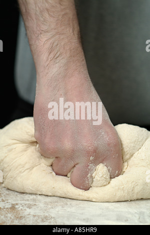 Male Kneading Bread Dough for Baking Stock Photo