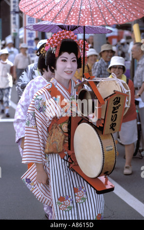 Chindonya, Japanese group of traditional street performers with bright ...