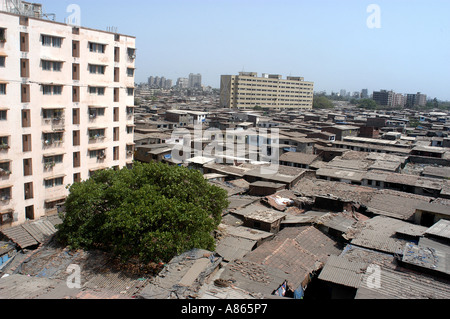 building in Bombay India surrounded by slums at Dharavi the biggest slum of Asia Stock Photo