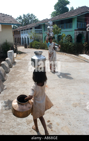 MPD77543 A girl child on her way to fetch water from the local well in Roha Raigadh India Stock Photo