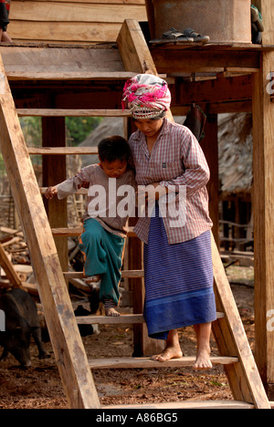 Akha woman and child on steps Luang Nam Tha Province Northern Laos Stock Photo