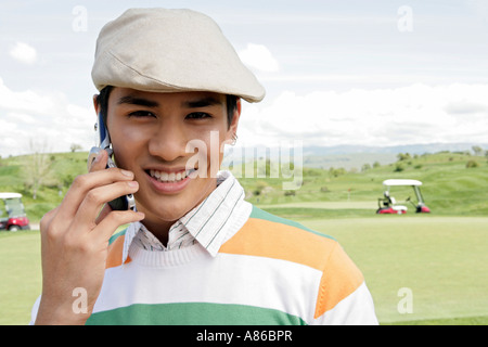 Portrait of a young man talking on a cellphone. Stock Photo