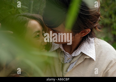 Young couple embracing, close-up Stock Photo