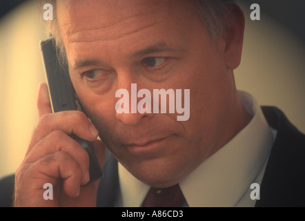 male executive on cell phone outdoors Stock Photo