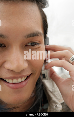One young man on the phone, close-up Stock Photo