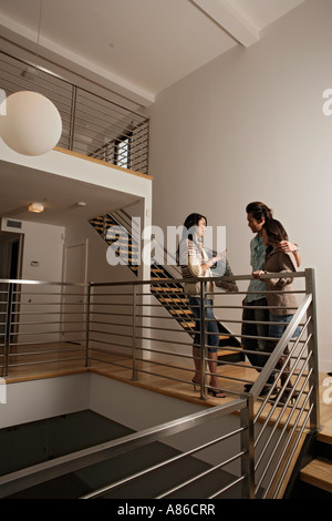 Conversation between three friends, full length Stock Photo