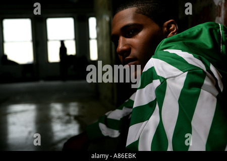 Young man wearing a striped hoodie Stock Photo