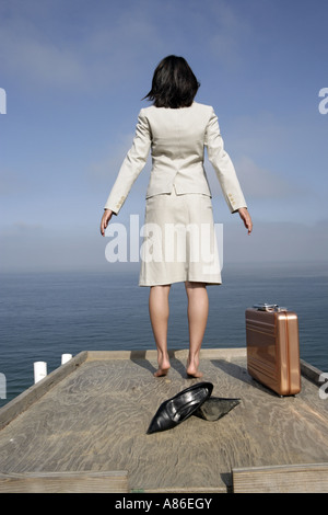 View of a woman standing on a wooden platform. Stock Photo
