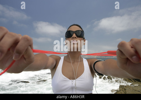 View of a woman holding a rope. Stock Photo