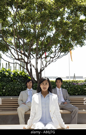 View of three colleagues in an office attire. Stock Photo