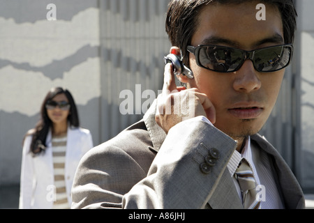 View of an executive using an earpiece. Stock Photo