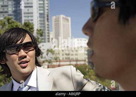 Two men are conversing. Stock Photo