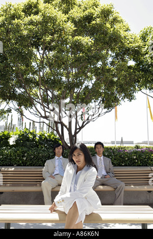 View of three colleagues sitting outdoors. Stock Photo