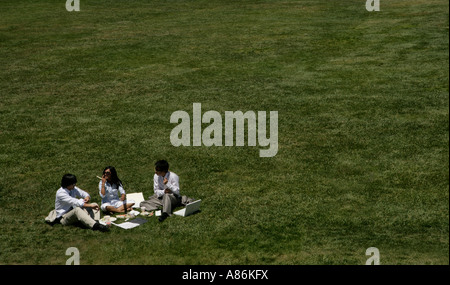 Three people having a picnic Stock Photo