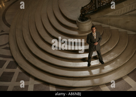View of a businessman standing on stairs. Stock Photo
