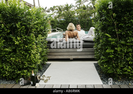 View of a couple lying on a mattress. Stock Photo