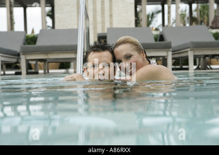 View of a couple underwater in a swimming pool. Stock Photo