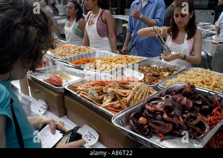 A stand selling fried fish at the Ninth Avenue Food Festival  Stock Photo