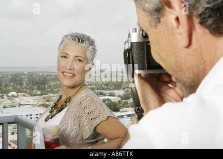Mature woman having her picture taken Stock Photo
