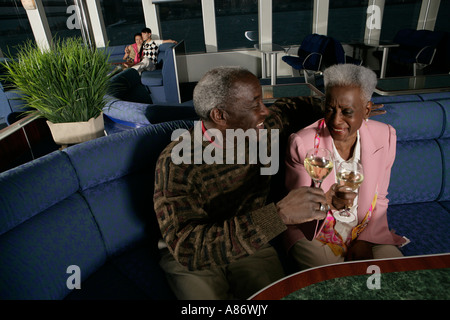 Senior couple toasting glasses Stock Photo