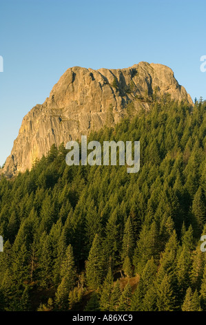 Pilot Rock, 5908 feet old volcanic plug rises about conifer forest Cascade Siskiyou National Monument Southern Oregon Stock Photo