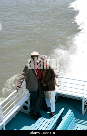 Mature couple standing on a boat Stock Photo