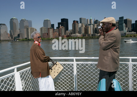 Mature man taking a picture of a woman Stock Photo