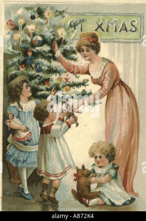 Christmas greeting card circa 1900 showing mother and children admiring