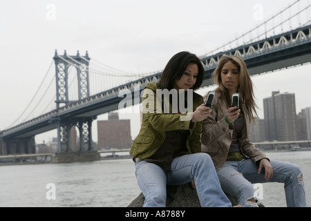 Portrait of two women with its cell phones. Stock Photo