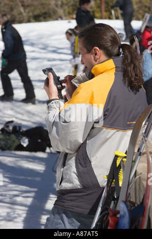 Man Uses Pda While On Ski Slopes At Sugar Mountain Resort In