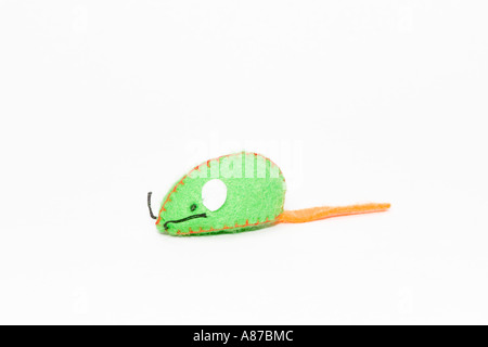 Close up of green and orange felt mouse shaped colorful cat toy on white background Stock Photo