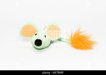 Close up of green and orange mouse shaped colorful cat toy on white background Stock Photo