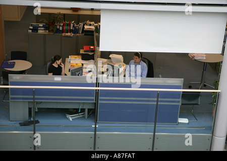 Two people working in office, elevated view Stock Photo