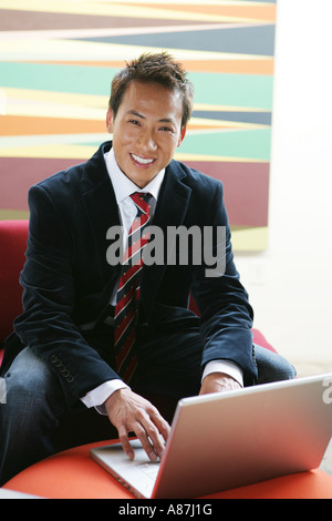 Young businessman looking at camera Stock Photo