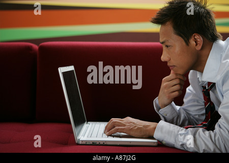 Young businessman looking at a laptop computer Stock Photo