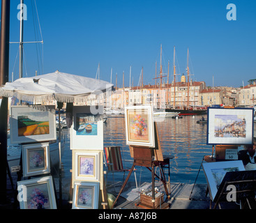Artists' s easels in the early evening in the Old Harbour, St Tropez ,French Riviera, France Stock Photo