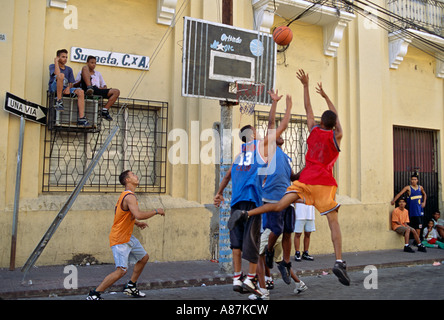 Dominican boys playing basketball on a street in Santo Domingo Stock Photo