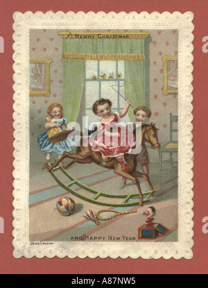 Christmas greeting card of children with toys circa 1875 Stock Photo