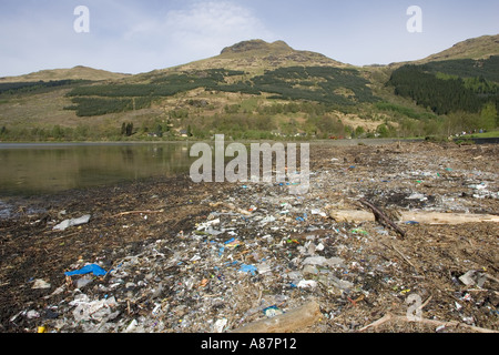 Litter debris on beach washed up from Clyde Estuary Loch Long Arochar Scotland Stock Photo