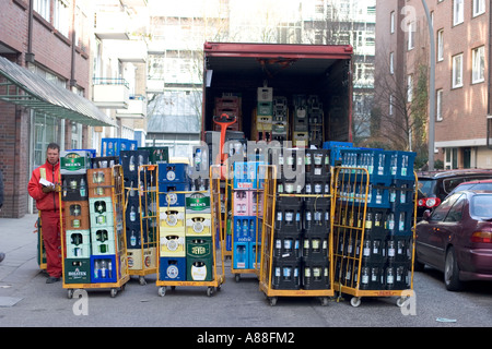 Germany, Hamburg, 24.02.2006. Bottled water and beers being delivered by truck in an alley. Stock Photo