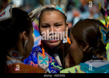 Participants in the annual Gathering of Nations powwow chatting before taking part in a contest Stock Photo