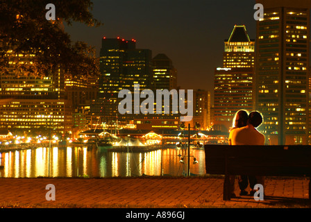 A couple enjoys the view from Federal Hill park of Baltimore s Inner Harbor Stock Photo