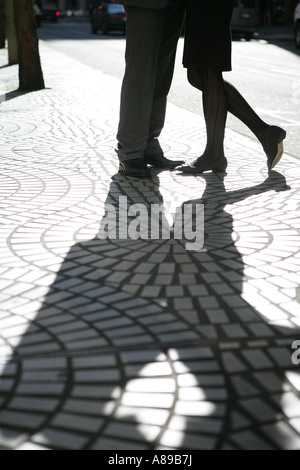 Shadow of two people standing on a bridge in Autumn Stock Photo - Alamy