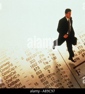 Businessman walking on stock quotes Stock Photo