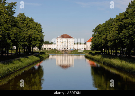 Canal of Castle Nymphenburg with parkway and middle part of Castle Nymphenburg in Munich, Upper Bavaria, Bavaria, Germany Stock Photo