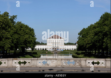 Canal of Castle Nymphenburg with parkway and middle part of Castle Nymphenburg in Munich, Upper Bavaria, Bavaria, Germany Stock Photo