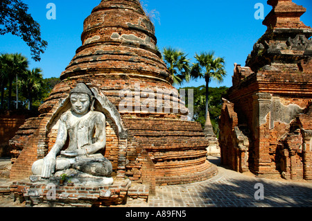 Sitting Buddha figure in ruined Aung Zaw Paya Ava Inwa Mandalay Burma Stock Photo