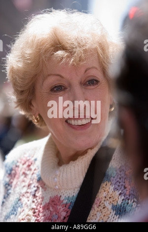 Older Caucasian woman in conversation Stock Photo