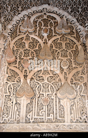 Oriental detail of with fine stucco richly decorated mihrab Medersa Ali Ben Youssef medina Marrakech Morocco Stock Photo