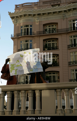 Couple shadow behind a map Stock Photo